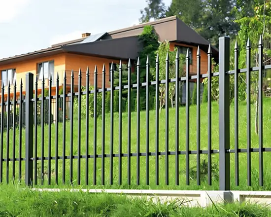 Spearhead top fence with decorative pointed design.